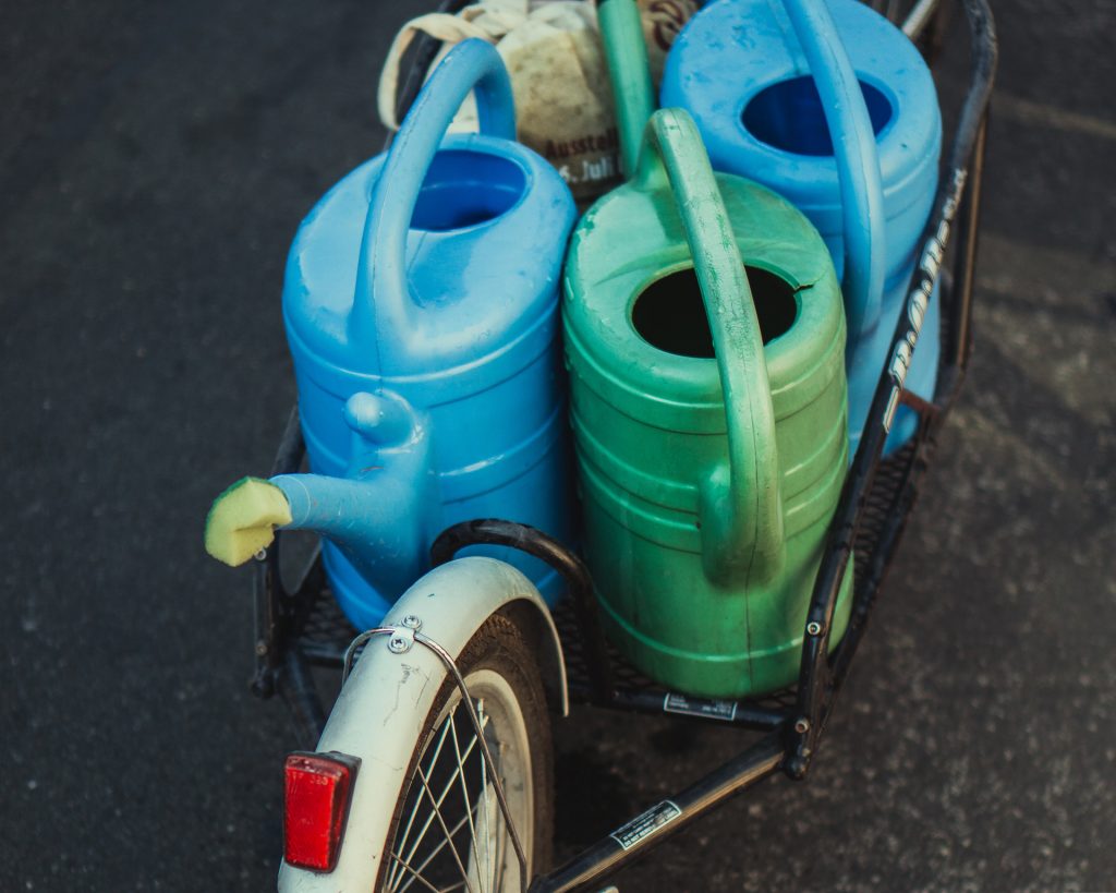 Watering cans on a cargo bike